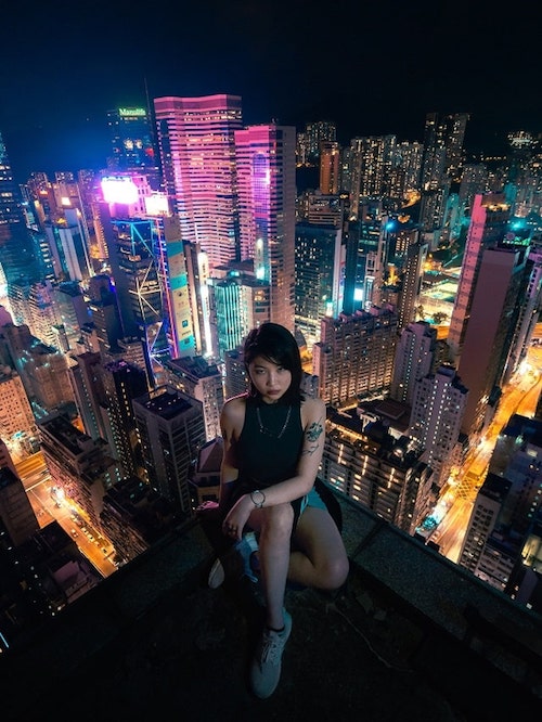 Stock Photos Women Pexels Woman Sitting On Rooftop