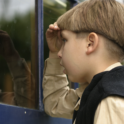 boy looking through storefront window