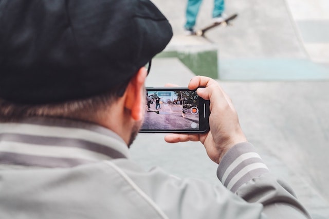 Man recording a video on a smartphone