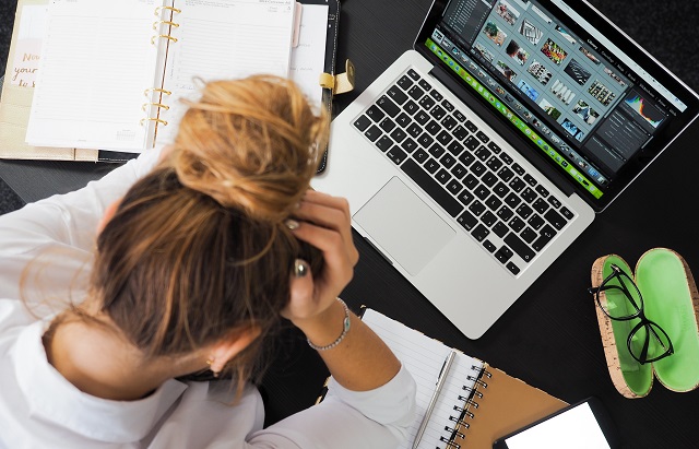 Woman Studying At A Computer