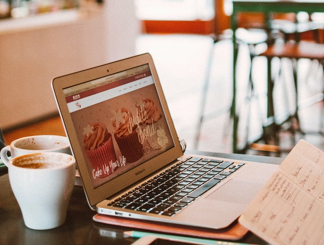 Laptop Open At Coffee Shop