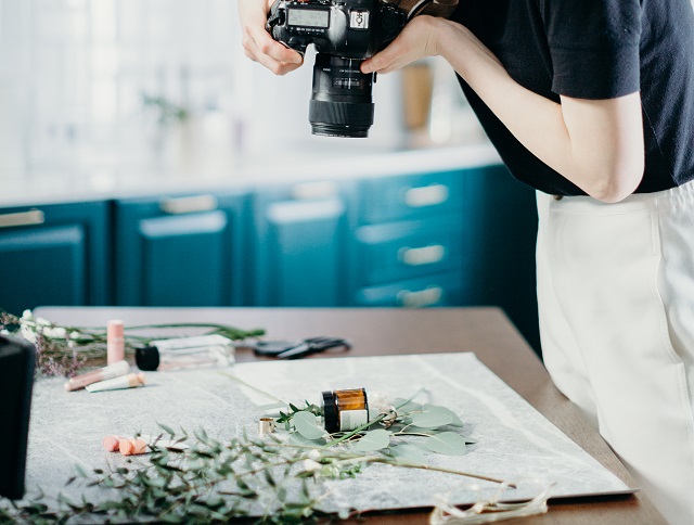 Person taking photos of their products