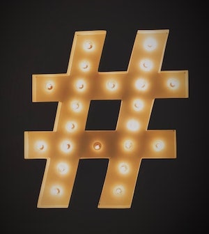 Gold hashtag on black background