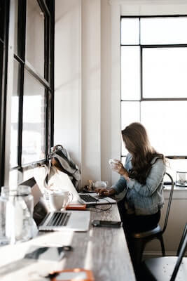 Woman sitting at coffee shop working