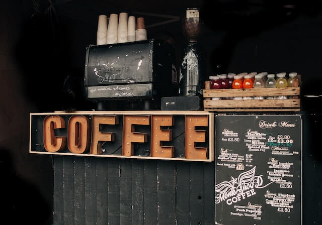 Small beverage stand with large signage reading “coffee”