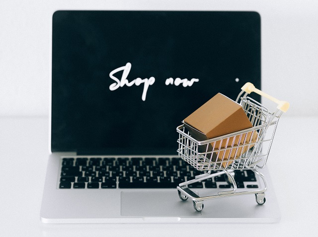 Laptop with shopping cart on keyboard