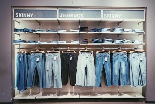 Jeans hanging up in store