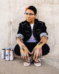Sara Sandoval with spray paint cans-1