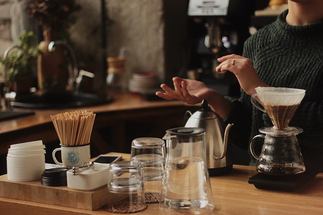 Barista with a pour-over brewer