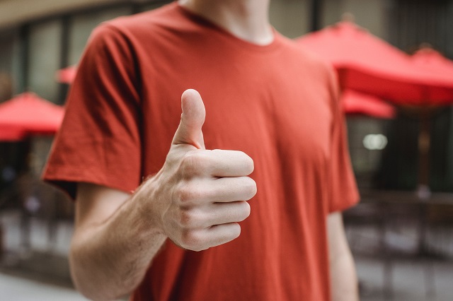 Person showing a thumbs-up sign