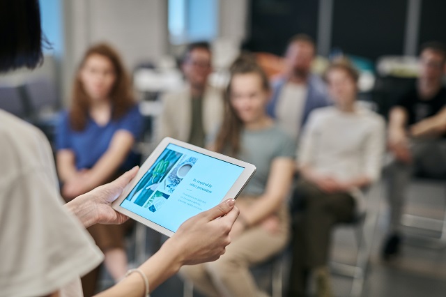 Person holding tablet in training session
