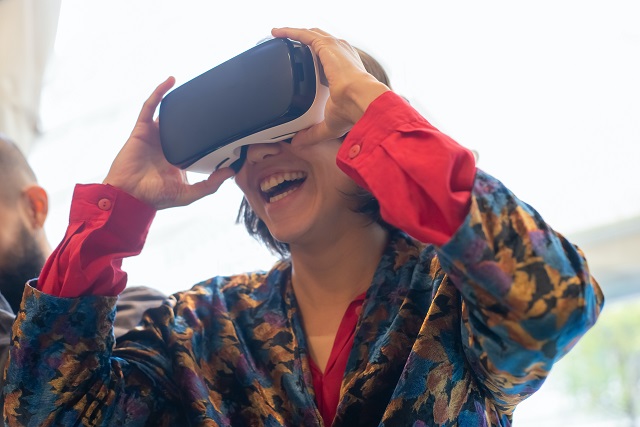 Person laughing while using VR headset