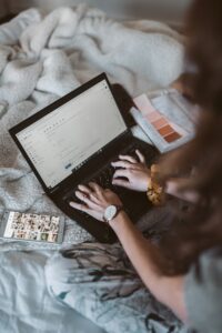 Woman composing email on laptop