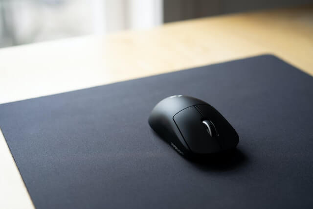 Close-up of black mouse on mousepad