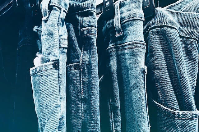 Close-up of denim pants in different shades of blue