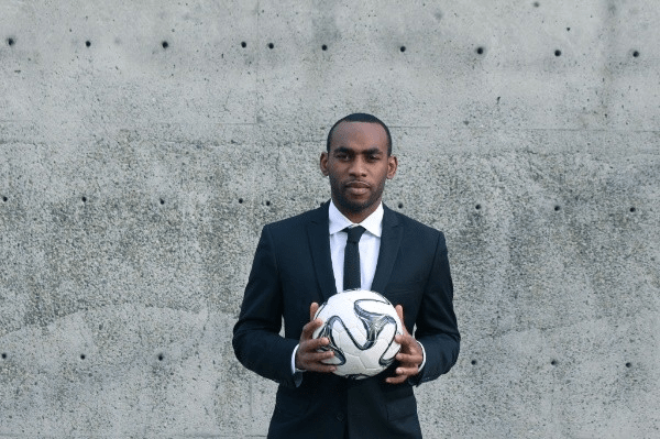 Amobi Okugo Holding Soccer Ball