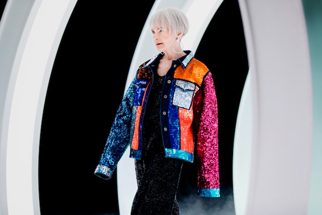 GoDaddy Lyn Slater Modeling Colorful Sequin Jacket