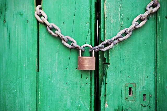 Padlock On A Wooden Door