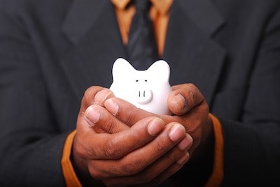 Man Holding Piggybank Illustrates Financial Management