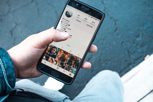 User Looking At Instagram On Smartphone