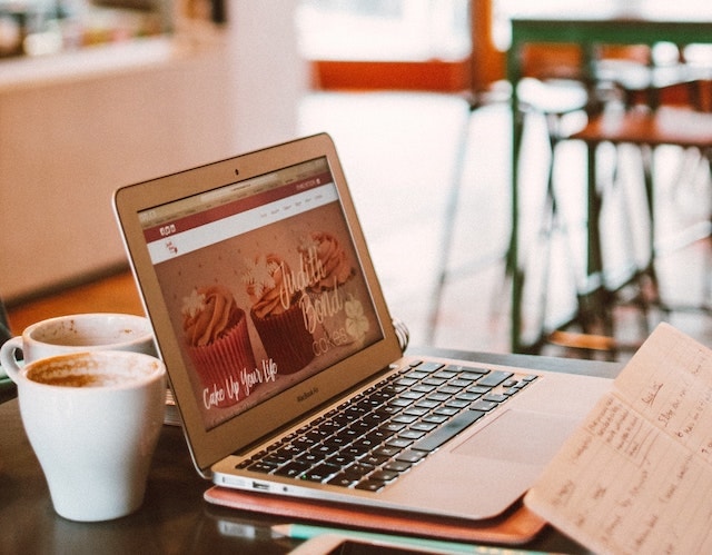 Starting a Web Design Business Laptop in Coffee Shop