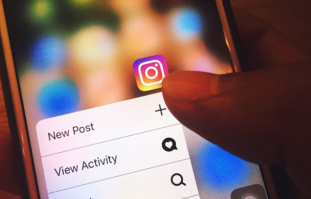 Instagram User Tapping New Post Option