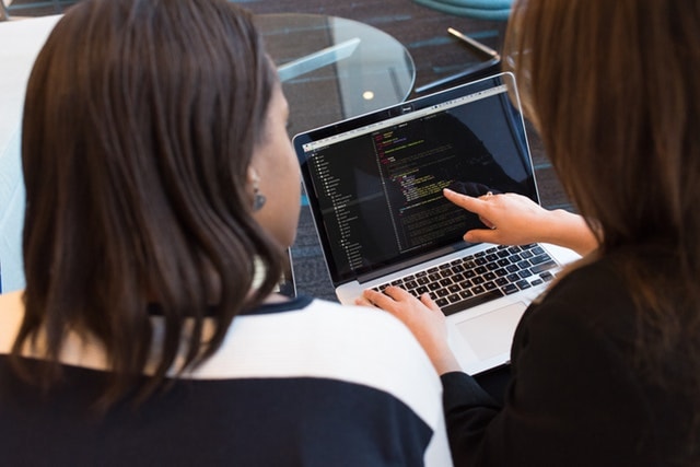 Two Women Working Together at Laptop