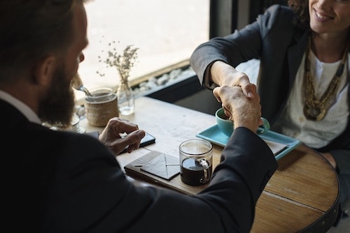 Web Design Contract Handshake Over Coffee