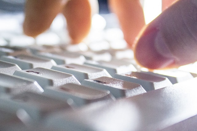 Hand typing on keyboard