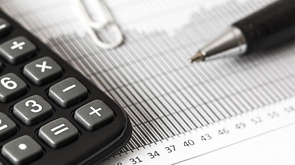 Calculator and pen on paperwork