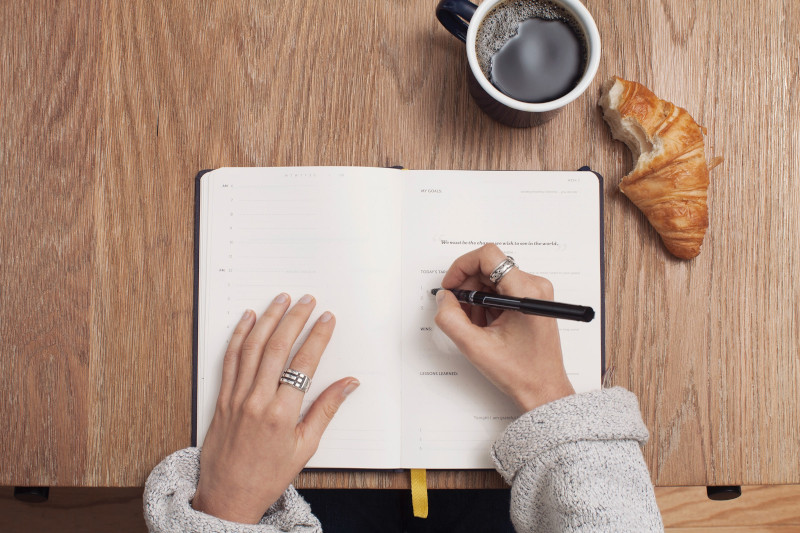 copywriting notebook croissant coffee