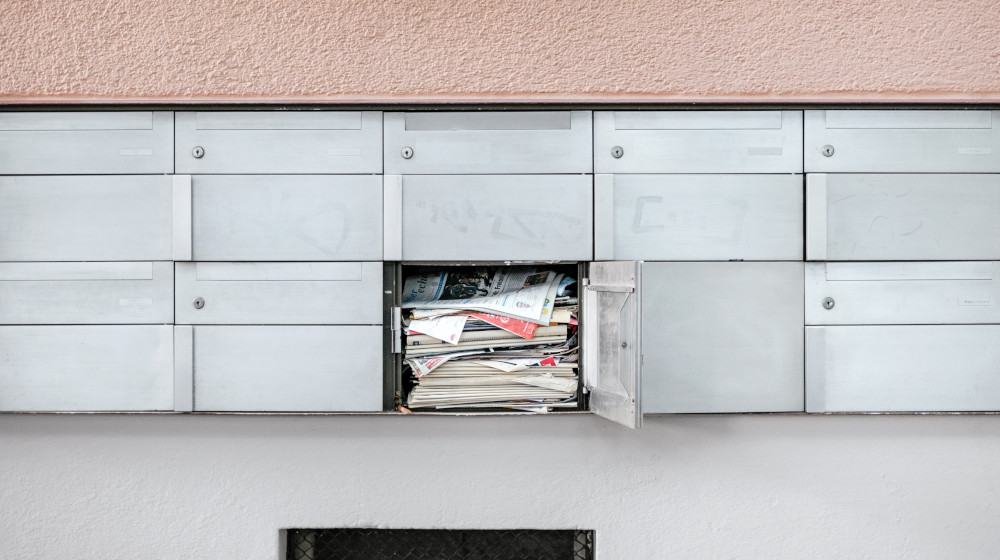 mail box full newspapers