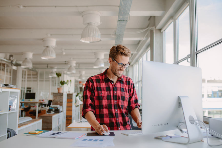 Shot,Of,Happy,Young,Man,Working,On,Desktop,Computer,In