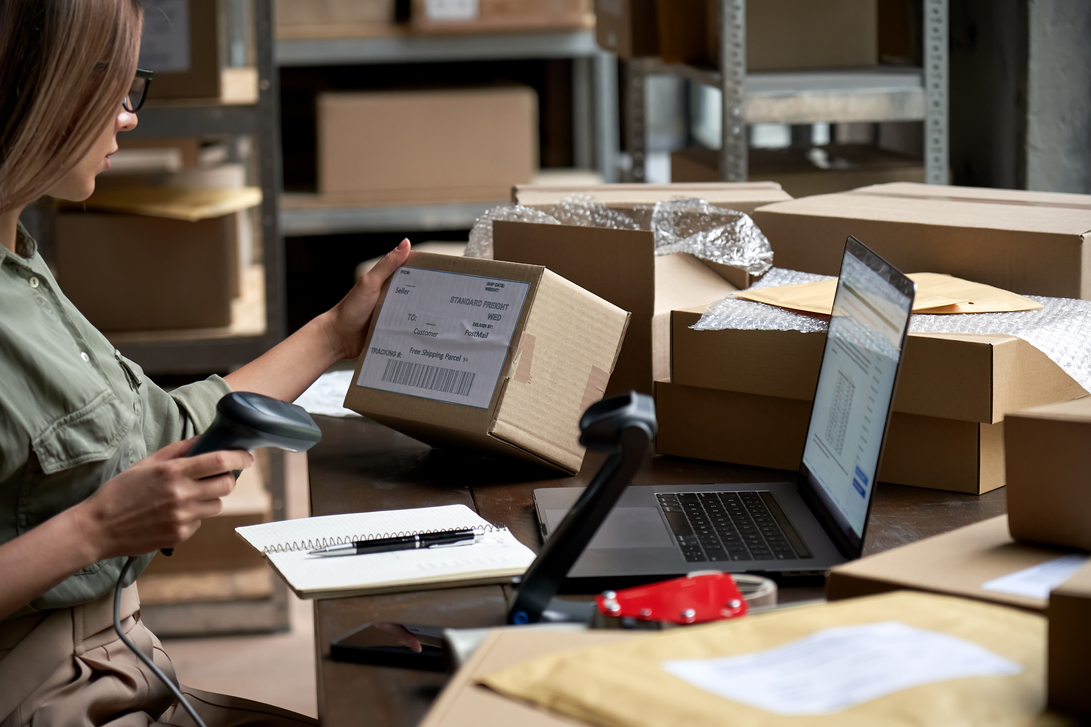 Female Seller Worker Online Store Holding Scanner Scanning Parcel Barcode