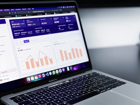 a laptop with statistics and analytics displayed