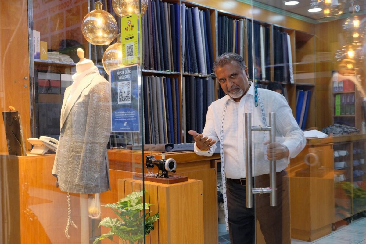 Prabhakar from Vijay fashion welcoming visitors to his shop