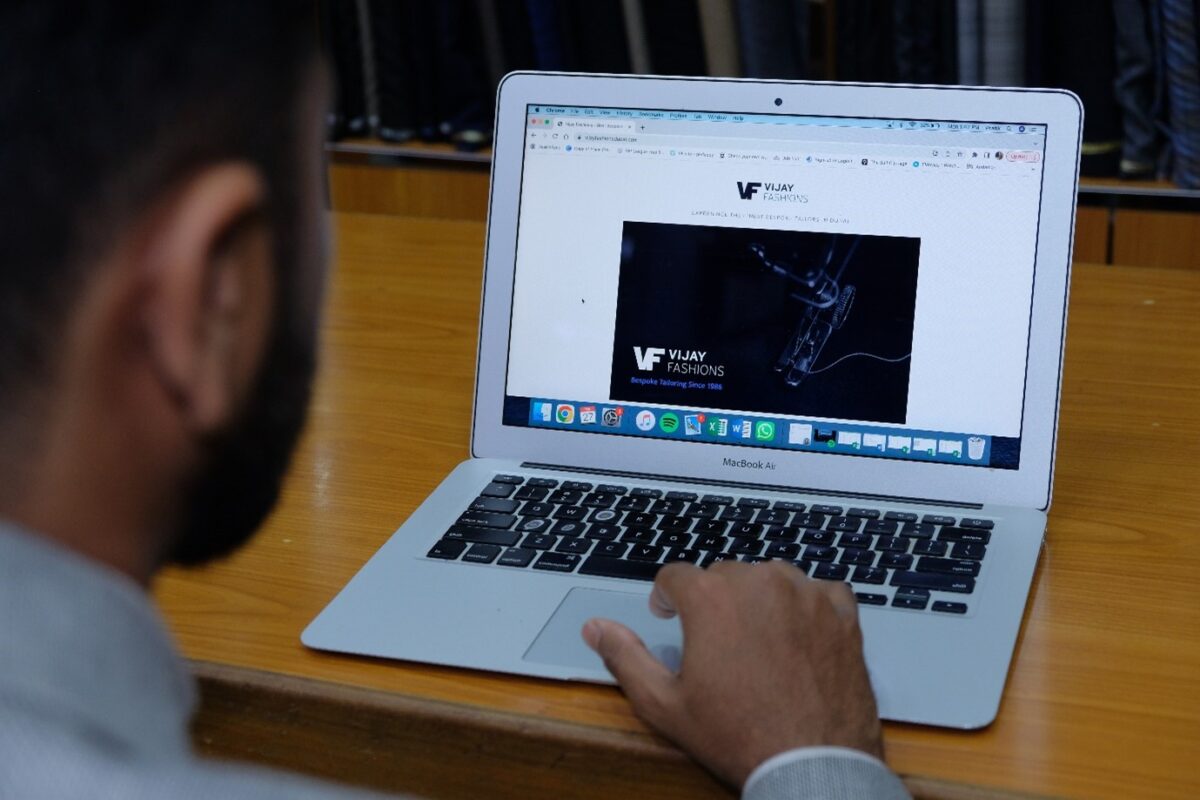 Pratik designing Vijay Fashion's website using the GoDaddy website builder