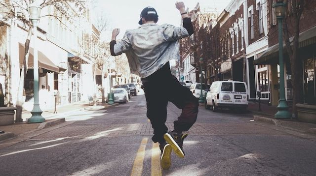 Communication Plan Man Jumping in Street