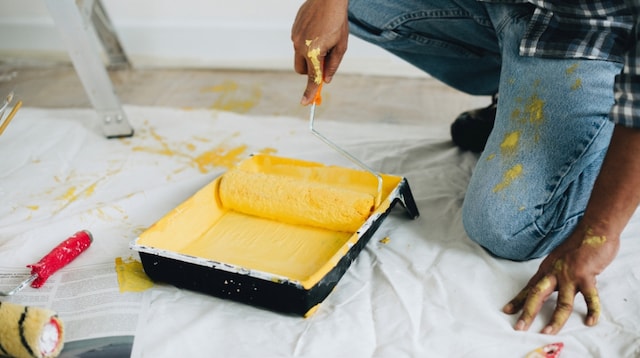 Niche Market Man Painting a Room