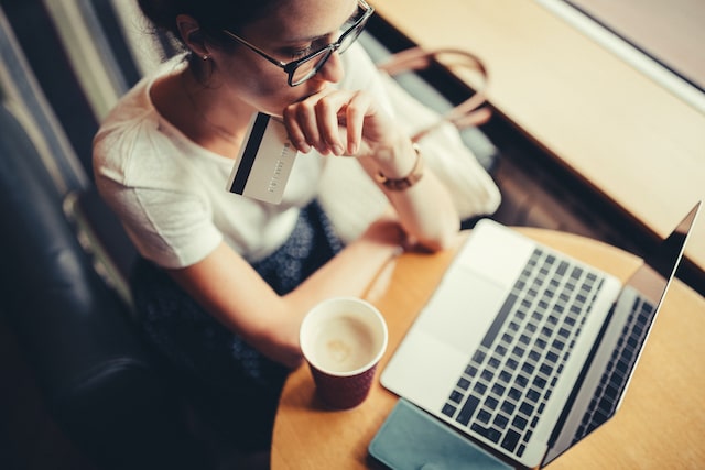 Overhead View of Woman Looking Anxious While Shopping Online