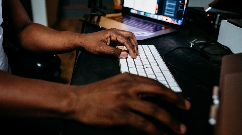 Web Page Man Typing on Keyboard