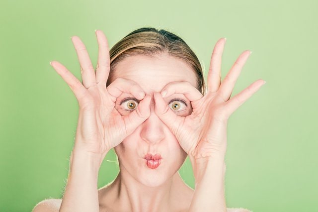 Woman making goggles with her hands