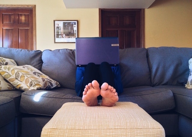 Work Life Balance Person on Couch with Laptop