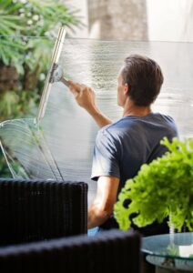 Workers' Compensation Insurance Person Cleaning Glass Partitions
