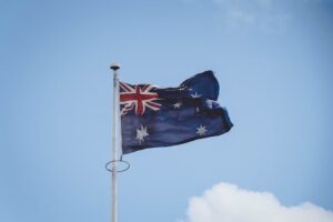 Australian flag waving in blue sky