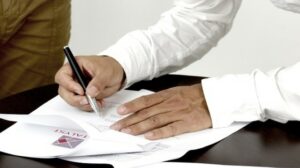 Franchise Your Business Person Signing a Contract