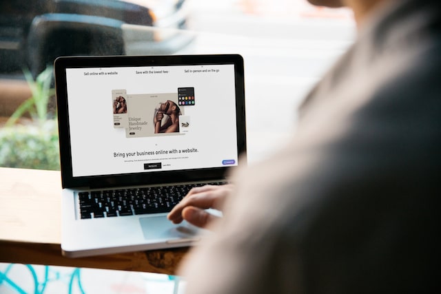 Person building a website on their laptop