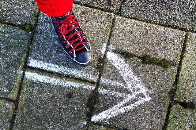 Retirement Planning Arrow Drawn on Pavement