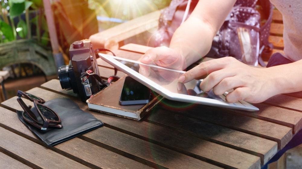 Woman building a website on a tablet