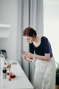 Woman taking a product photo with her iPhone